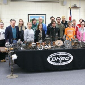 Judge Fregiato and Car Club Admire Trophies Made by Career Center Students